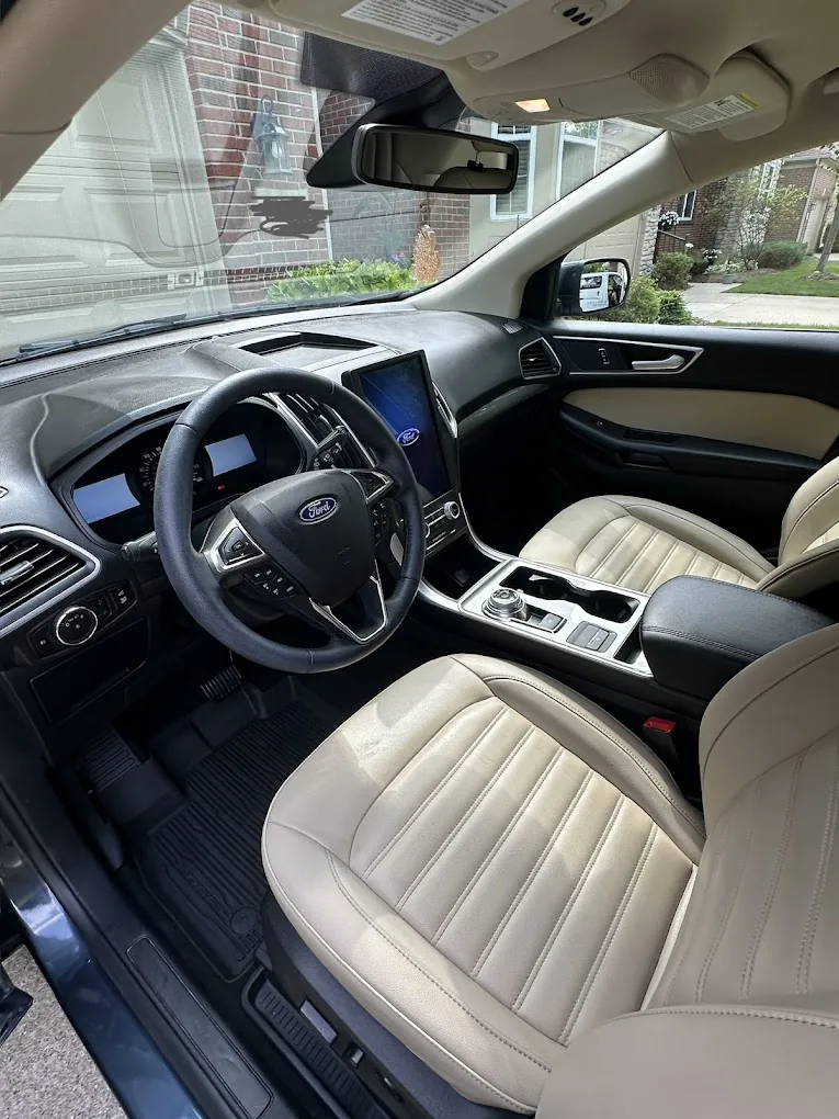 Clean light-colored Ford interior detailed by Fly Auto Spa